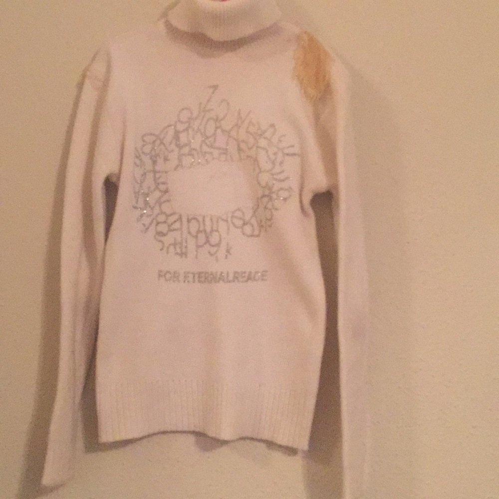 A white long sleeve sweater